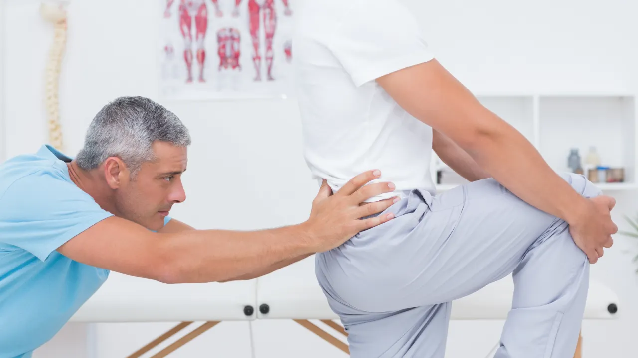 Physiotherapist providing treatment for neck pain