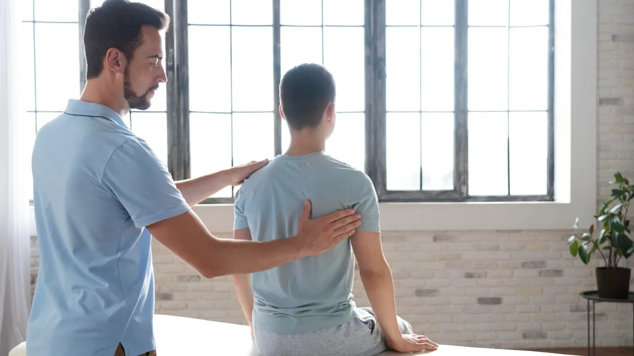 Physiotherapist providing treatment for neck pain