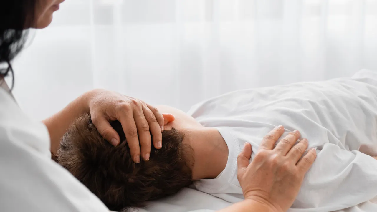 Physiotherapist providing treatment for neck pain