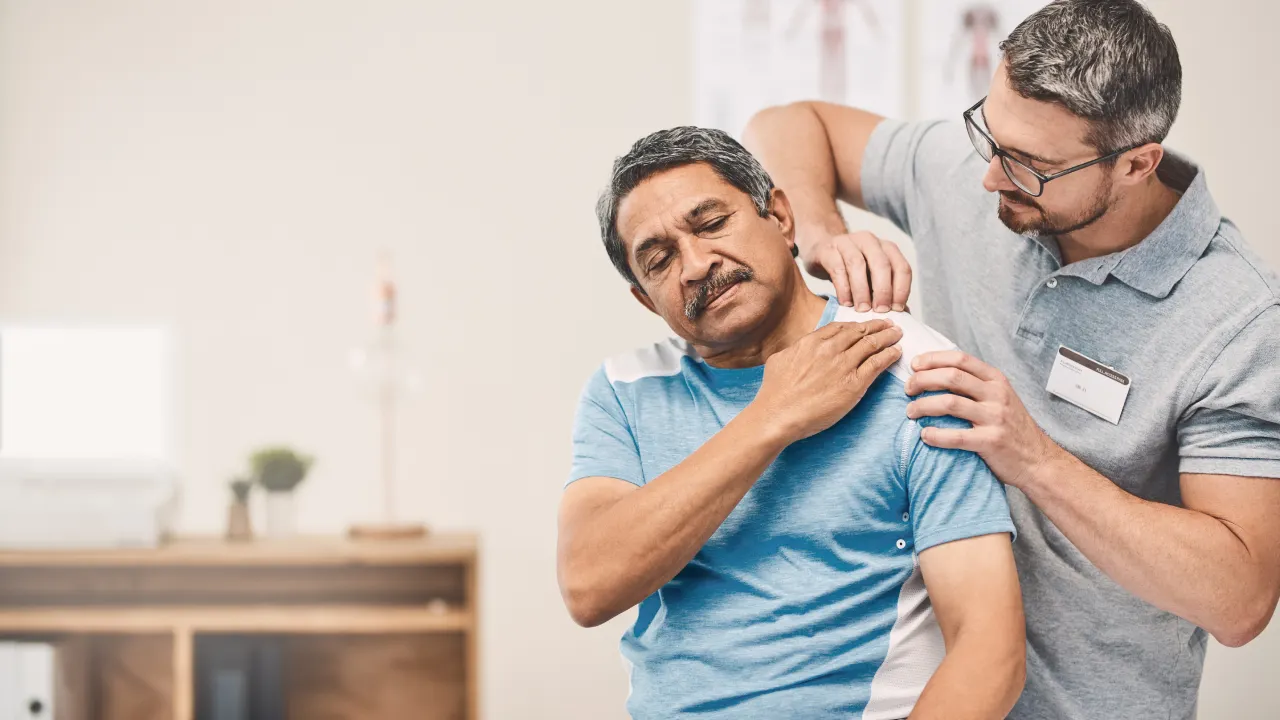 Physiotherapist providing treatment for neck pain