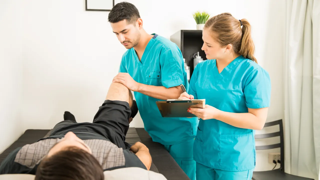 Physiotherapist providing treatment for neck pain