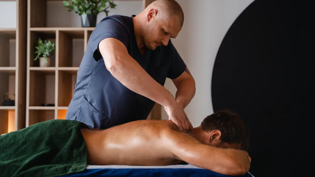 Physiotherapist providing treatment for neck pain