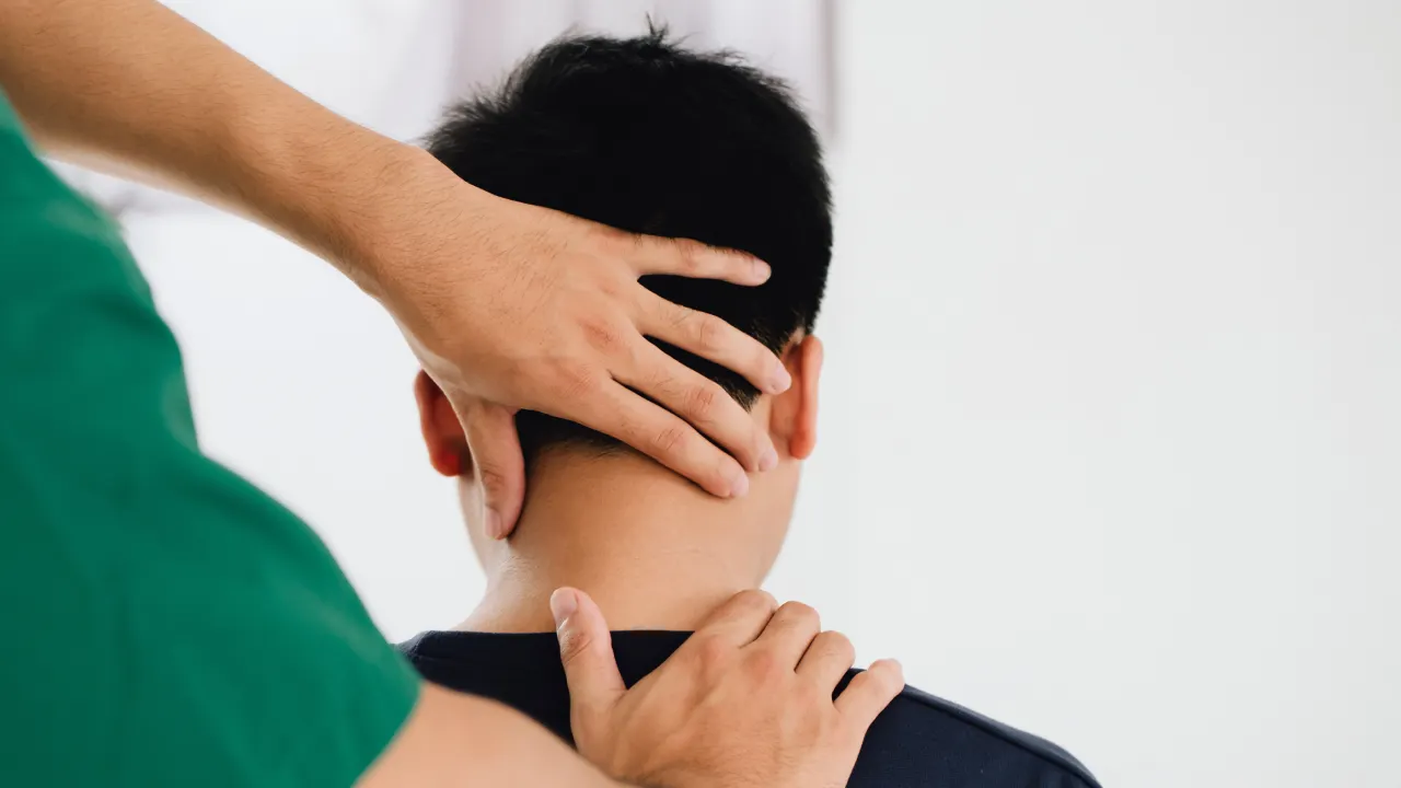 Physiotherapist providing treatment for neck pain